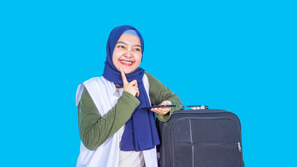 asian hijab woman traveler with suitcase on color background