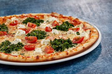 fresh pizza on the white plate