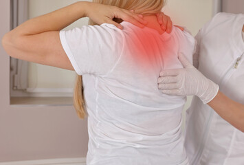 Female Patient With Back Ache Visiting Doctor's Office. Chiropractic, Osteopathy, Physiotherapy...