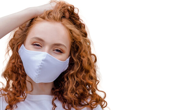 Woman wearing protective face mask, posing on white background. Close up studio portrait.  isolated, empty copy space for text