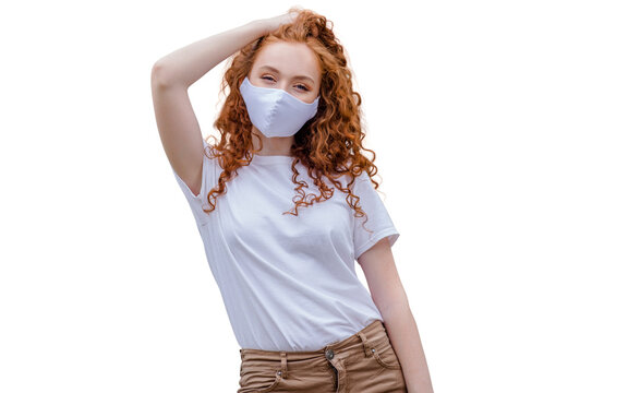 Woman wearing protective face mask, posing on white background. Close up studio portrait.  isolated, empty copy space for text
