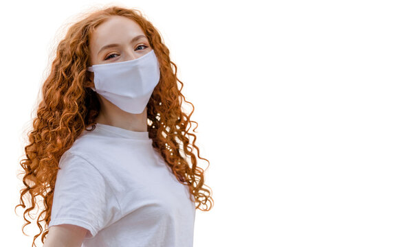 Woman wearing protective face mask, posing on white background. Close up studio portrait.  isolated, empty copy space for text