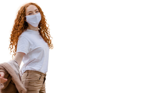 Woman wearing protective face mask, posing on white background. Close up studio portrait.  isolated, empty copy space for text