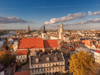 Obraz premium A drone view of the historic city with the market square, churches, town hall and the castle tower in Opole during sunset. Autumn in Silesia - Poland.