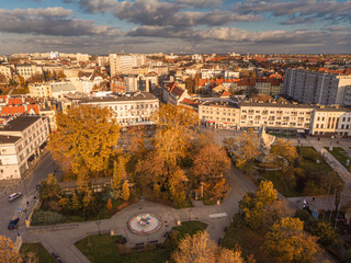 Fototapeta na wymiar A drone view of the historic city with the market square, churches, town hall and the castle tower in Opole during sunset. Autumn in Silesia - Poland.