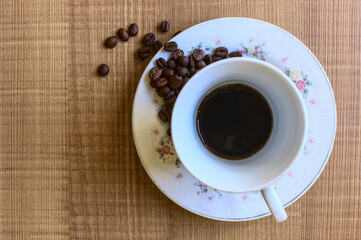 cup of coffee breakfast roasted beans wooden table white kitchen utensil