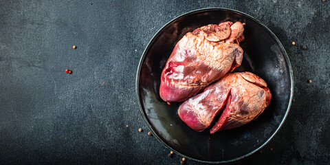heart raw offal pork or beef meat snack ready to eat on the table healthy meal ingredient top view copy space for text food background rustic 