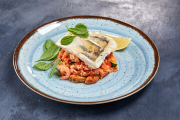 white fish with rice and vegetables