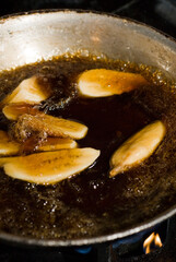 Bananas foster Dessert. Classic Creole or Cajun dessert favorite. Bananas sautéed in butter and caramelized sugar and served with cookies, whipped cream, cake, ice creams and chocolate syrup.