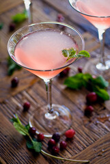 Cocktails. Alcoholic Drinks made with gin, vodka, rum or whiskey mixed with soda water, fruit juices and garnishes with limes and cherries. Classic American bar drinks.