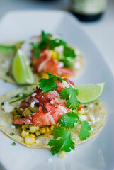Fish or Lobster Tacos. Grilled lobster, mango slices, cheese, grilled bell peppers, onions, limes, cilantro and served on homemade corn tortillas. Classic Mexican or Tex-mex favorite.