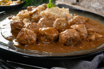 Minced meat balls in mushroom sauce.