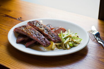 Pork ribs, barbecue style. Classic Traditional Texas Smokehouse favorite menu item: Baby Back pork ribs. Slow cooked in seasoned smoker over mesquite wood chips covered in homemade bbq sauce. 