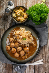 Minced meat balls in mushroom sauce.
