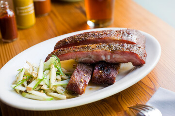 Pork ribs, barbecue style. Classic Traditional Texas Smokehouse favorite menu item: Baby Back pork ribs. Slow cooked in seasoned smoker over mesquite wood chips covered in homemade bbq sauce. 