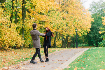 Young couple wearing masks together in forest