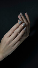 Amazing natural nails with nailers. Women's hands with manicure art.