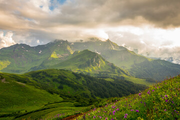 Obraz premium Beautiful mountain landscape at Caucasus mountains with clouds and blue sky
