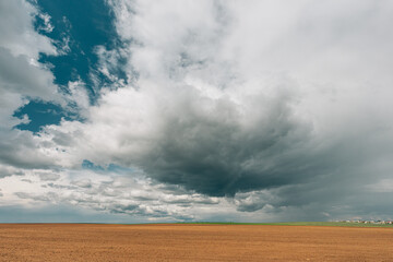 Countryside Rural Field Landscape With Empty Brown Soil. Early Spring Agricultural Season