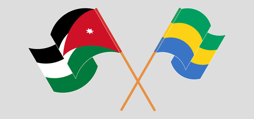 Crossed and waving flags of Jordan and Gabon