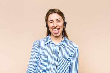 blonde pretty woman with cheerful, carefree, rebellious attitude, joking and sticking tongue out,...