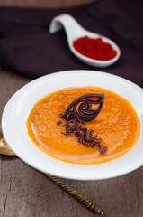 Spicy Pumpkin Soup Garnished with Chocolate