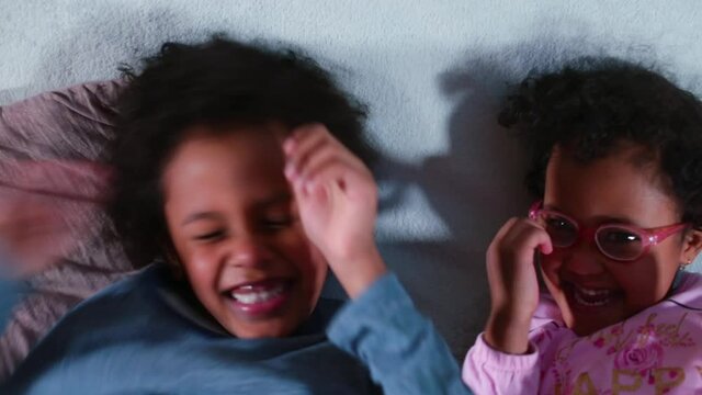 The black girl makes a kiss to the boy. Children in kindergarten show love. Showing feelings of sympathy for each other.