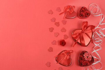 The concept of Valentine's Day or Women's Day. Greeting card, hearts and gift boxes on a red background, place for text, banner, Happy holiday, congratulations, birthday, selective focus