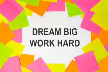 Text dream big work hard on a white background. Multicolored stickers around