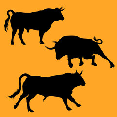 isolated black silhouettes of three different Bulls \ standing, running, attacking\, a set of isolated silhouettes for design and decor