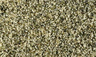 Peeled hemp seed background and texture, top view