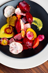 Beet salad. Classic Steakhouse salad made with organic beets, iceberg lettuce, cherry tomatoes, blue cheese dressing, carrots and Italian parsley. Traditional restaurant salad.