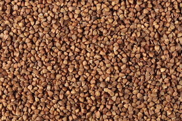 Buckwheat seed pile background and texture, top view