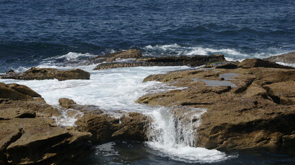 waves crashing on rocks