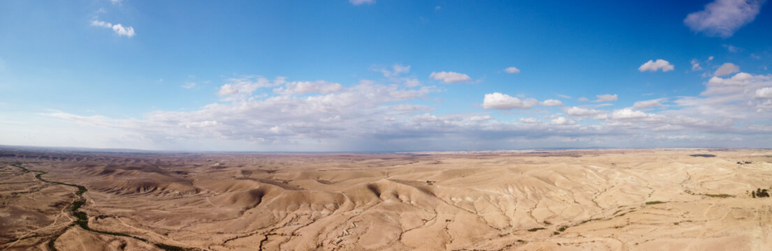 Wide panorama of the Negev desert from a clouds
