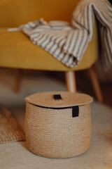 Jute baskets placed next to the fireplace, a cozy place in the living room