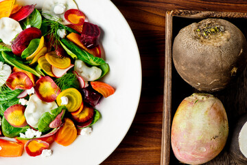 Beet salad. Classic Steakhouse salad made with organic beets, iceberg lettuce, cherry tomatoes, blue cheese dressing, carrots and Italian parsley. Traditional restaurant salad.