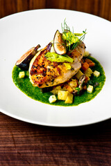 Chicken breast, pan seared to a crispy golden brown in brown butter and served with farm fresh organic vegetables: carrots, Brussels sprouts and green beans. Classic American restaurant favorite.