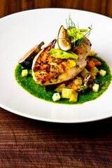 Chicken breast, pan seared to a crispy golden brown in brown butter and served with farm fresh organic vegetables: carrots, Brussels sprouts and green beans. Classic American restaurant favorite.