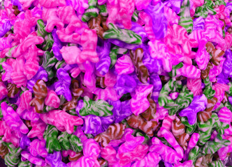 Colorful texture using as background. A lot of sweets. Background 3d rendering illustration. Orange and black multiple jelly candies in powdered sugar. Confectionery wallpaper concept. Copy space