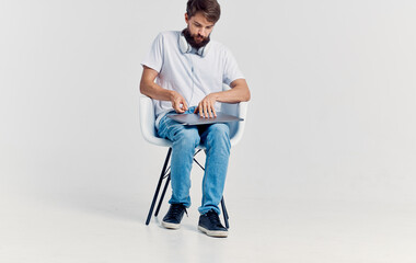 Man sitting on chair laptop technology communication lifestyle