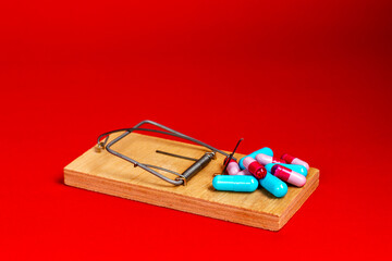 Medical pills, medicines are in a wooden mousetrap. Medical healthcare, life insurance.