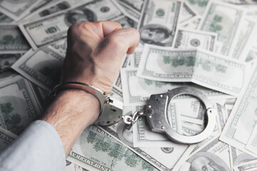 money and handcuffs bribery of the authorities