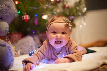 baby child with christmas tree