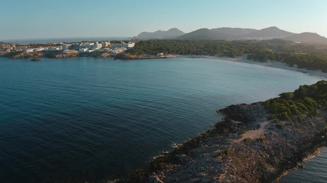 Aerial drone shot in Cala Agulla. Beach in Mallorca, Balearic Island