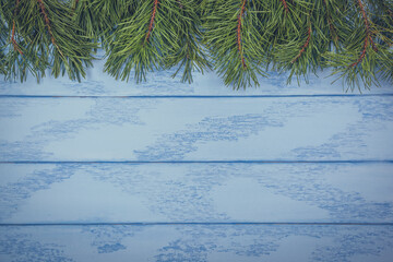 Christmas or New Year mock up: pine branches on the one side of blue boards