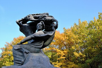 Warsaw, Poland. Frederic Chopin monument. Large, bronze statue of Frederic Chopin located  in the upper part of Warsaw's Royal Baths. Autumn time