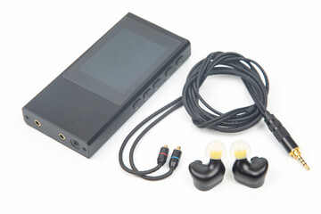 In-ear headphones for Hi-Fi music player. Audio sound and modern equipment for music lovers and...