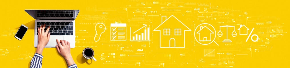 Real estate theme with person using a laptop computer