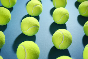 Tennis balls on blue background. Sports equipment